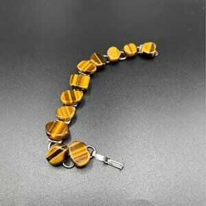 Vintage genuine tiger's eye gemstone link bracelet with a clasp closure.